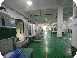 CNC machining workshop view with organized equipment area